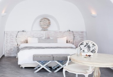 Bedroom of the Suite Sea View luxury accommodation at San Antonio Santorini Hotel in Imerovigli.